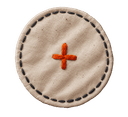 A small circular canvas badge with a hand-stitched border.